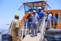 Tourism-PS-John-Ololtuaa-and-visitors-disembark-the-water-bus-to-Ndere-Island.-A-water-bus-safari-is-one-of-the-enjoyable-tourism-experiences-at-Lake-Victoria.jpeg